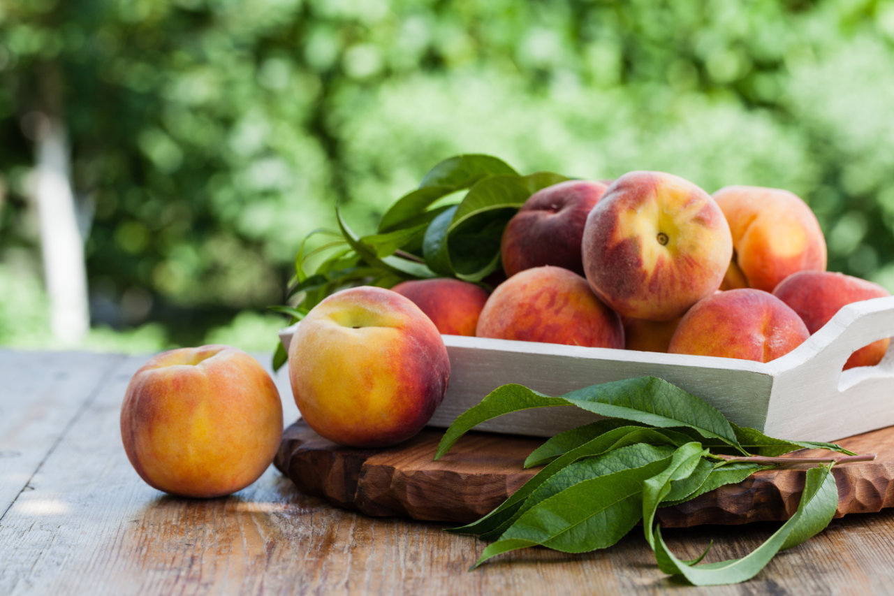 a small basket of peaches